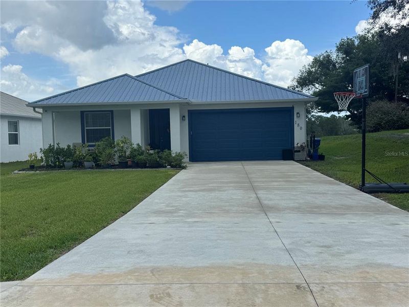 Front exterior of a new home in , Osteen, FL, highlighting curb appeal (Image 20).