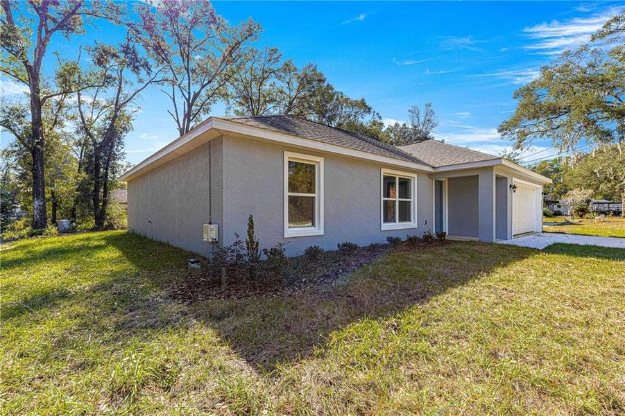 Front exterior of a new home in , Belleview, FL, highlighting curb appeal (Image 2). Front exterior of a new home in , Belleview, FL, highlighting curb appeal (Image 2).