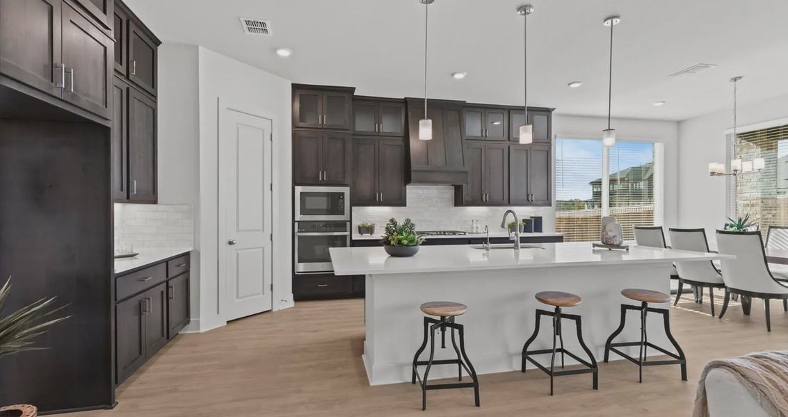 Representative furnished interior of a home built from the Waterloo by Chesmar Homes in Village at Three Oaks, Seguin (Image 12). Representative furnished interior of a home built from the Waterloo by Chesmar Homes in Village at Three Oaks, Seguin (Image 12).