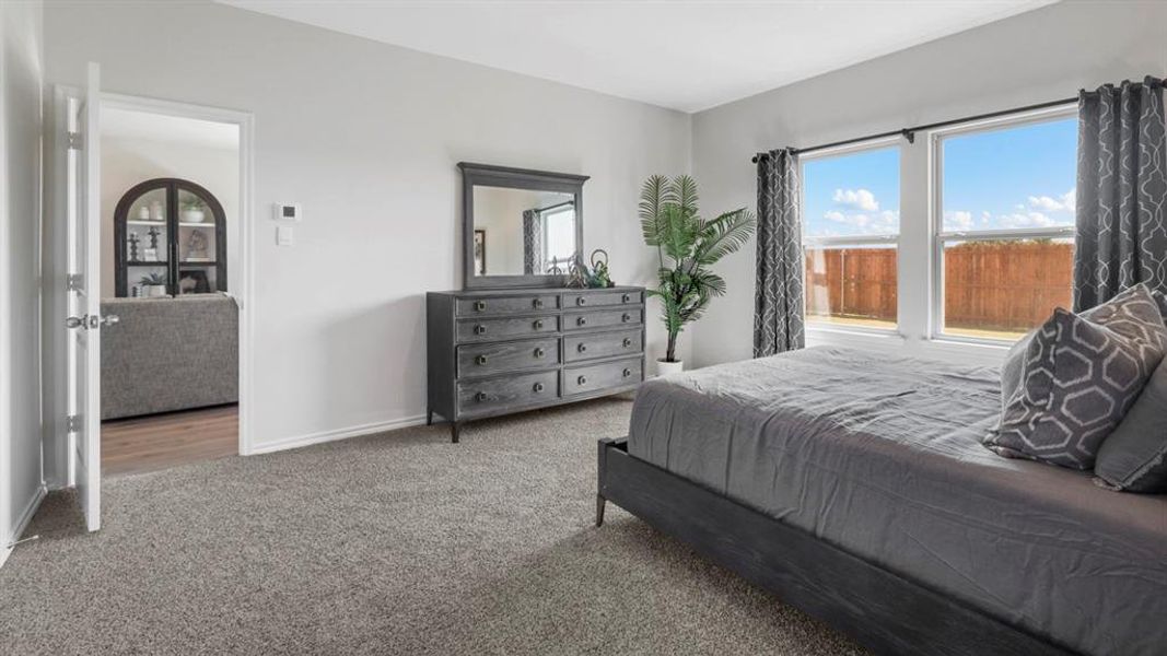 Carpeted bedroom with baseboards