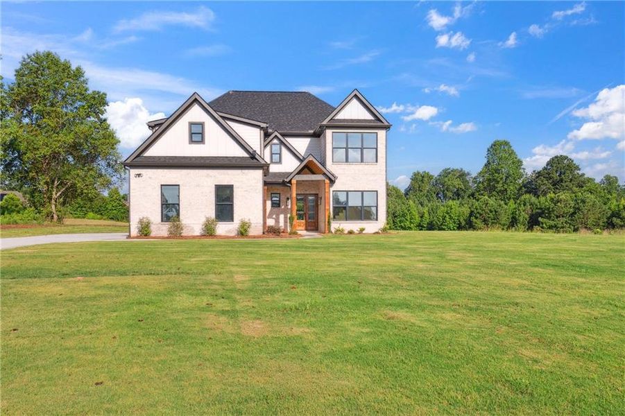 Front exterior of a new home in , Jefferson, GA, highlighting curb appeal (Image 28).