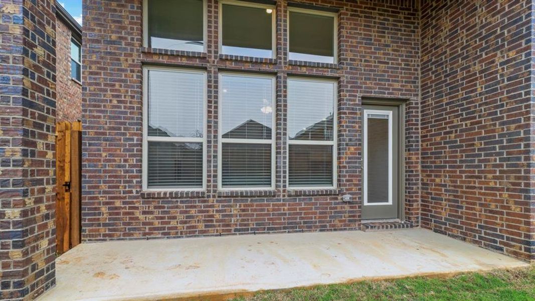Exterior details and patio area of a home in The Woods at Lindsey Place, Anna (Image 1). Exterior details and patio area of a home in The Woods at Lindsey Place, Anna (Image 1).