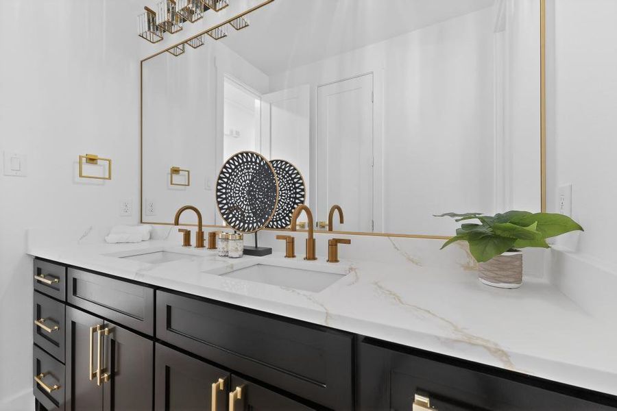 Hall Bathroom featuring double vanity