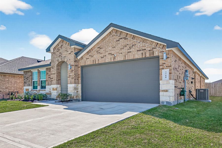 Closer exterior view of the brick and stone detail, double wide driveway 2-car garage includes seller upgraded recessed lighting. Closer exterior view of the brick and stone detail, double wide driveway 2-car garage includes seller upgraded recessed lighting.