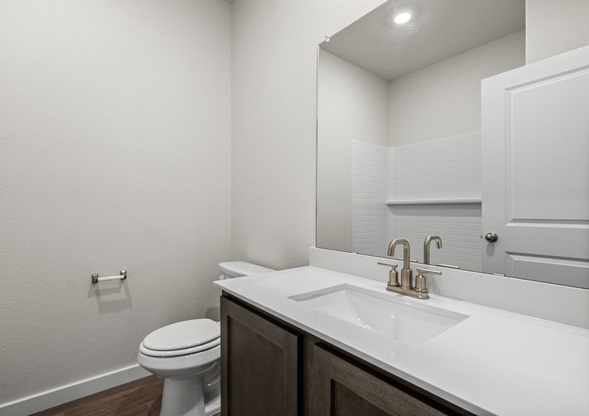 The secondary bathroom has a sprawling vanity space.