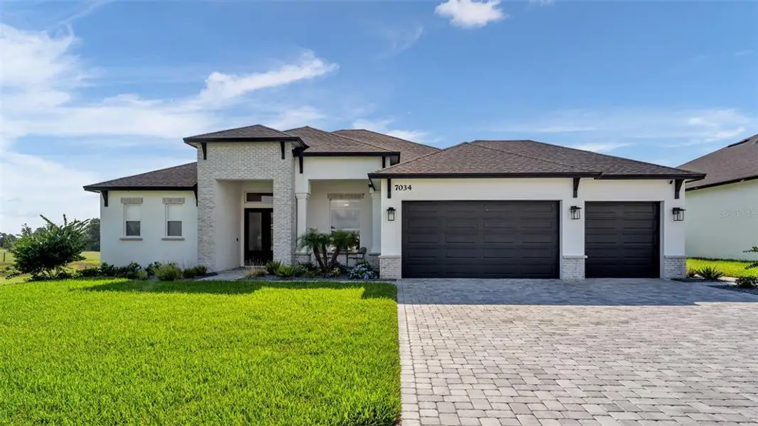 Front exterior of a new home in , Lakeland, FL, highlighting curb appeal (Image 2). Front exterior of a new home in , Lakeland, FL, highlighting curb appeal (Image 2).