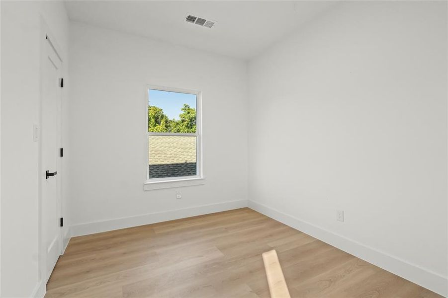 Unfurnished bedroom featuring light wood finished floors and a closet Unfurnished bedroom featuring light wood finished floors and a closet