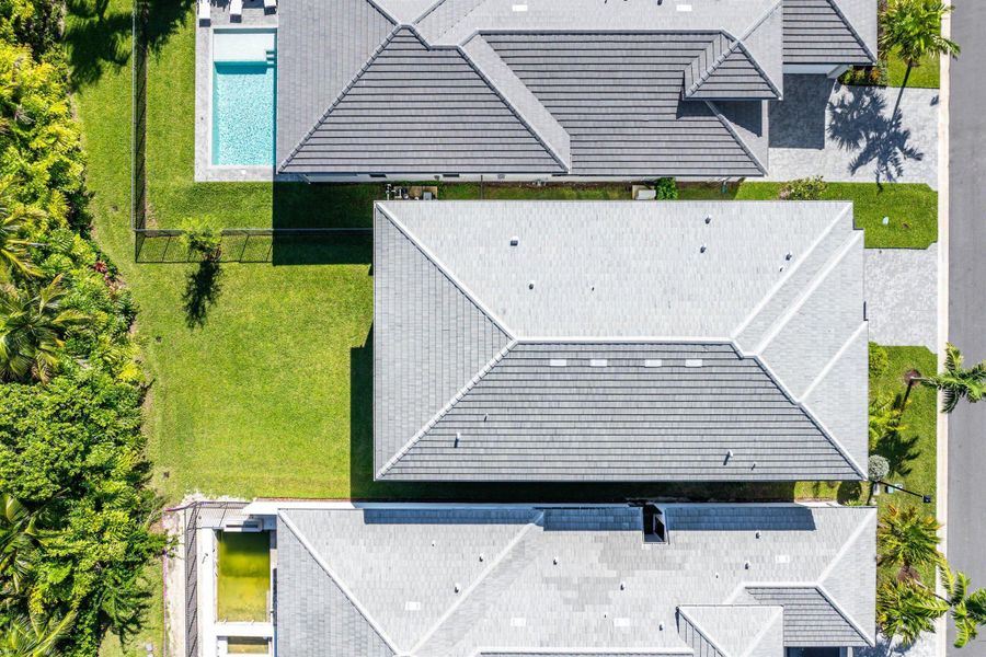 Front exterior of a new home in Lotus Edge, Boca Raton, FL, highlighting curb appeal (Image 38).