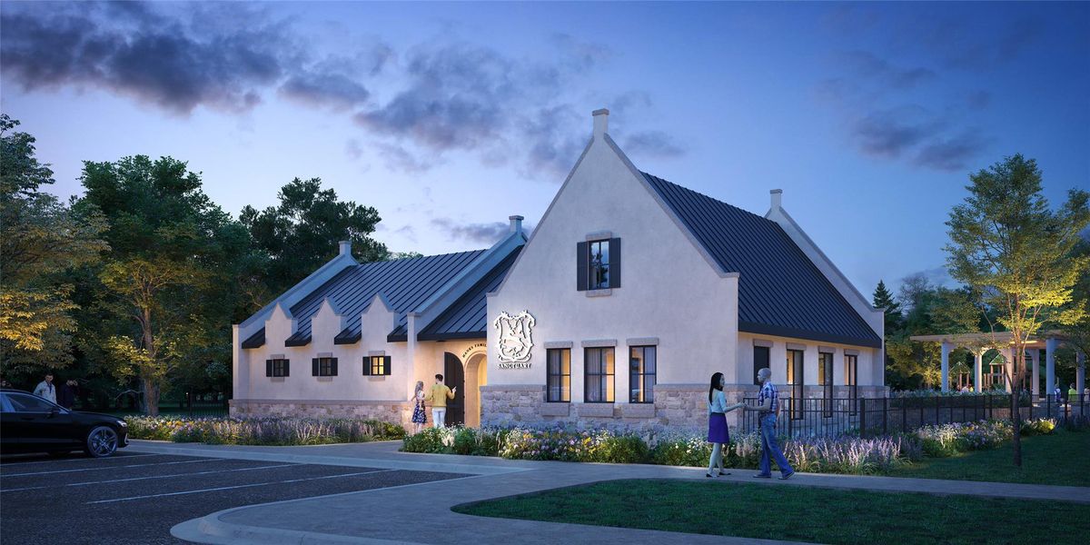 A charming European-inspired building featuring a stone base, white stucco, and a dark metal roof, set against a twilight sky. A charming European-inspired building featuring a stone base, white stucco, and a dark metal roof, set against a twilight sky.