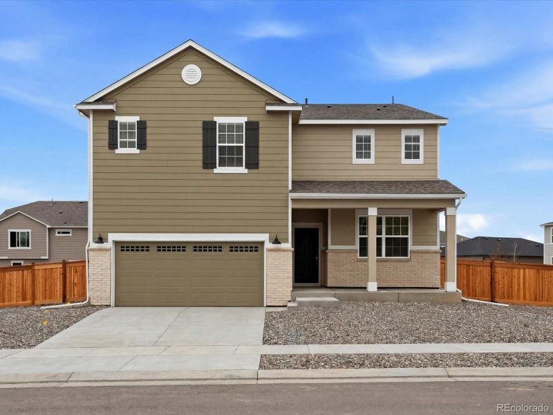 Front exterior of a new home in , Commerce City, CO, highlighting curb appeal (Image 1). Front exterior of a new home in , Commerce City, CO, highlighting curb appeal (Image 1).