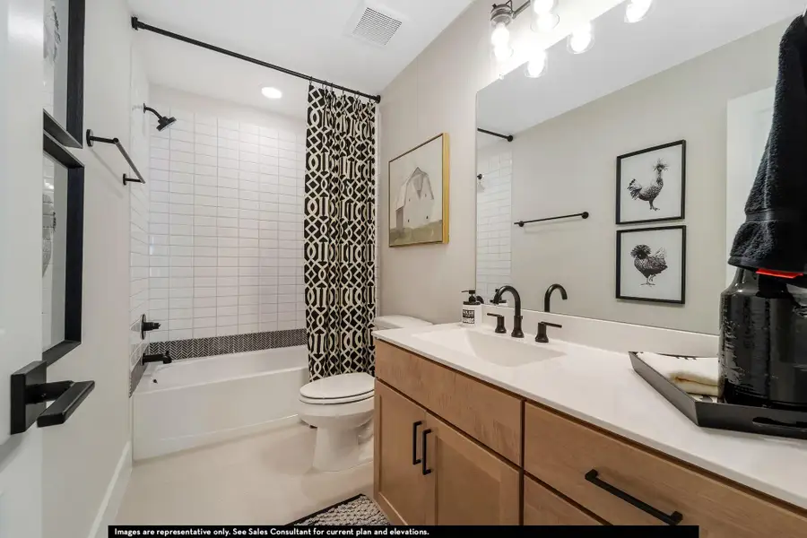 Bathroom featuring shower / bathtub combination with curtain, vanity, tile patterned floors, and recessed lighting Bathroom featuring shower / bathtub combination with curtain, vanity, tile patterned floors, and recessed lighting