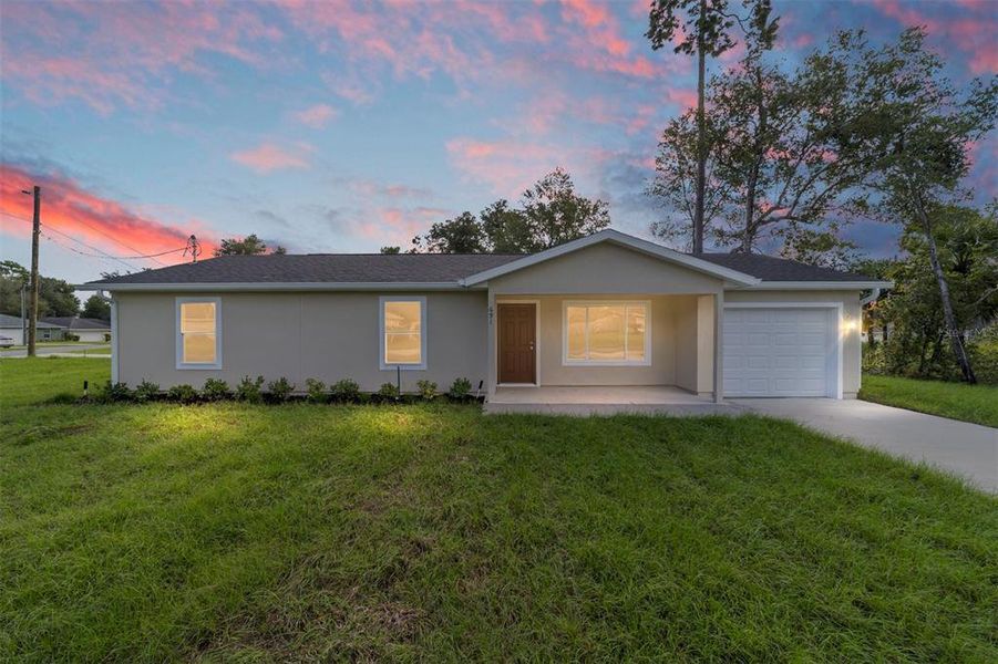 Front exterior of a new home in , Dunnellon, FL, highlighting curb appeal (Image 1). Front exterior of a new home in , Dunnellon, FL, highlighting curb appeal (Image 1).