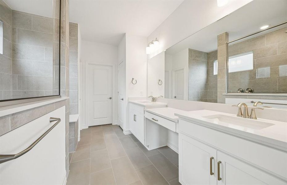 Modern owner's bath with dual vanities and a spacious shower *Real home pictured Modern owner's bath with dual vanities and a spacious shower *Real home pictured