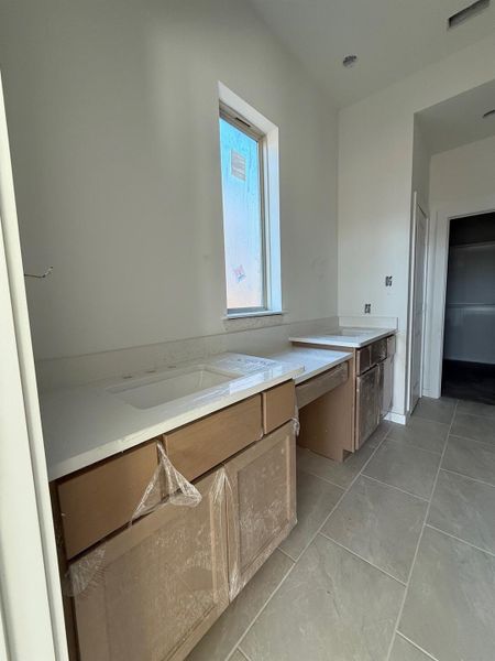 Dual vanity sinks in the primary bathroom. Dual vanity sinks in the primary bathroom.