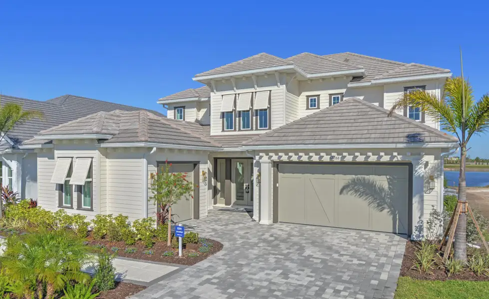 Front exterior of a new home in Wellen Park, Venice, FL, highlighting curb appeal (Image 2). Front exterior of a new home in Wellen Park, Venice, FL, highlighting curb appeal (Image 2).
