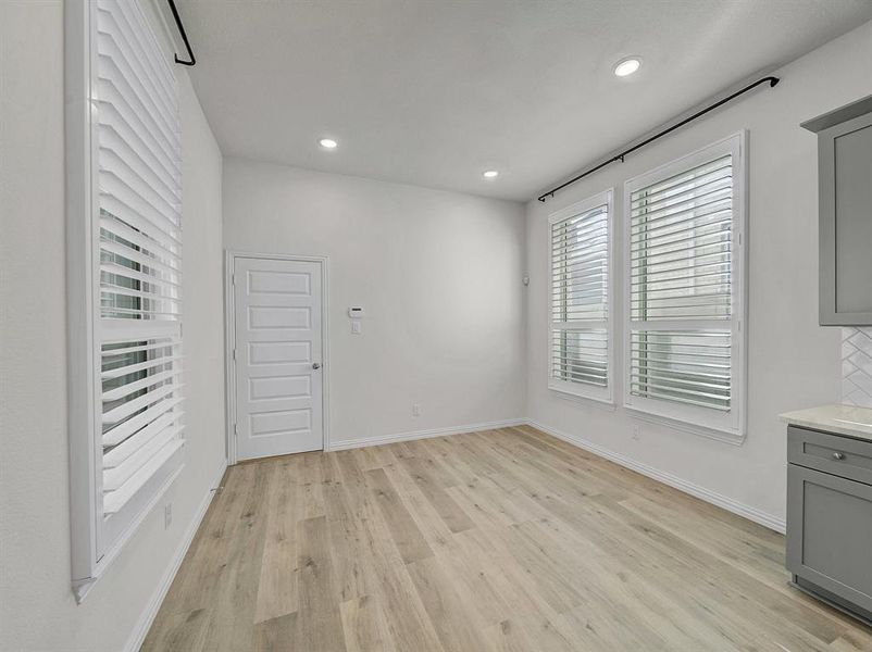 Unfurnished dining area with light hardwood / wood-style floors