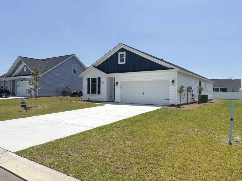Front exterior of a new home in Briarfield, Conway, SC, highlighting curb appeal (Image 2). Front exterior of a new home in Briarfield, Conway, SC, highlighting curb appeal (Image 2).