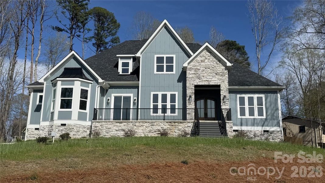 Front exterior of a new home in , Troutman, NC, highlighting curb appeal (Image 1). Front exterior of a new home in , Troutman, NC, highlighting curb appeal (Image 1).