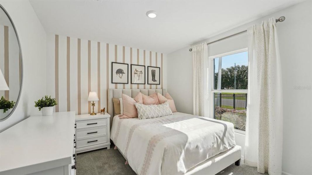 Furnished interior view inside a new home in Triumph South, Wildwood (Image 6).
