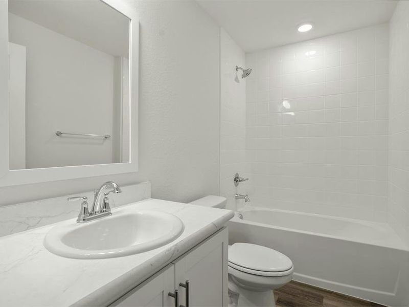 Secondary bedrooms share a convenient hall bath.