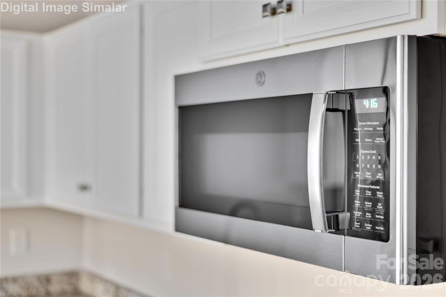 The stainless steel appliances add a sleek, contemporary touch—think professional-grade performance with a polished finish that complements any décor. From the refrigerator to the range, every detail is thoughtfully chosen to elevate your cooking experience.