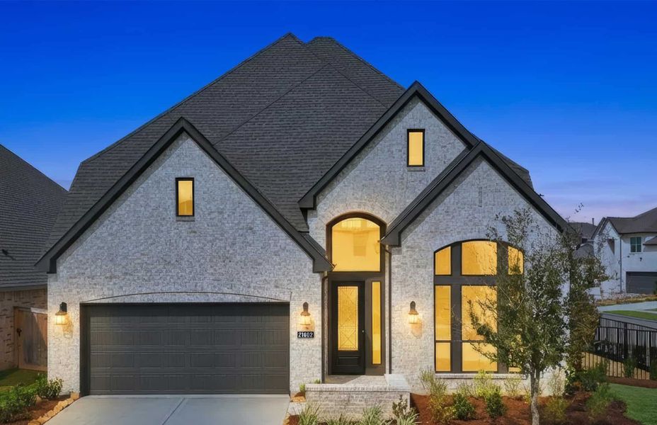 Front exterior of a new home in Bridgeland 50′, Cypress, TX, highlighting curb appeal (Image 2). Front exterior of a new home in Bridgeland 50′, Cypress, TX, highlighting curb appeal (Image 2).