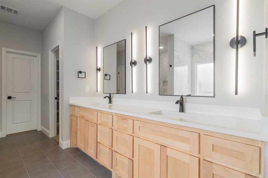 Bathroom with dual bowl vanity and tile floors