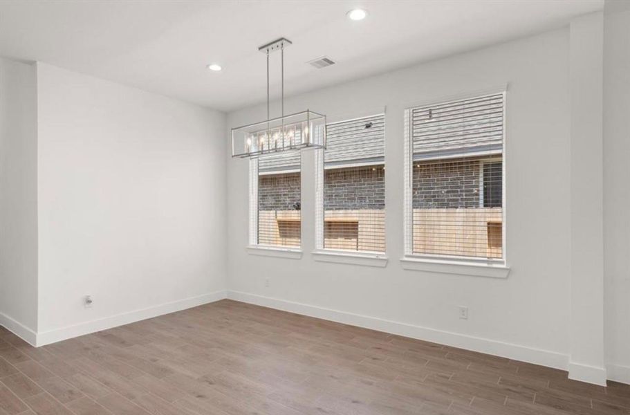 Spacious, unfurnished interior of a new home in Sunterra, Katy (Image 10).