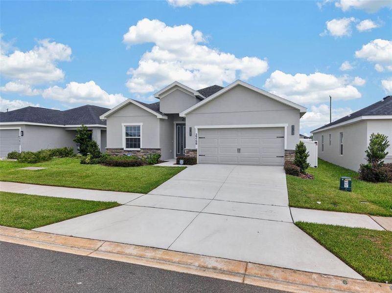 Front exterior of a new home in , Davenport, FL, highlighting curb appeal (Image 31).