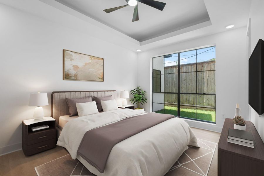 Virtually Staged: Secondary bedroom with engineered wood floors, a tray ceiling with a ceiling fan, a large window, and recessed lighting. Virtually Staged: Secondary bedroom with engineered wood floors, a tray ceiling with a ceiling fan, a large window, and recessed lighting.