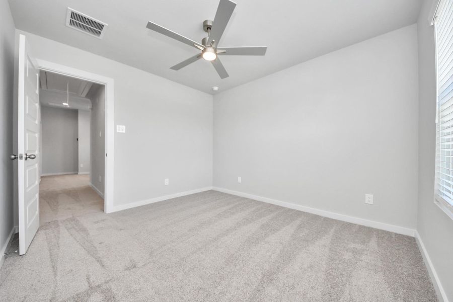 Generously sized secondary bedrooms featuring spacious closets, soft and inviting carpeting underfoot, large windows allowing plenty of natural light, and the added touch of privacy blinds for your personal retreat. Sample photo of completed home with similar floor plan. Actual colors and selections may vary. Generously sized secondary bedrooms featuring spacious closets, soft and inviting carpeting underfoot, large windows allowing plenty of natural light, and the added touch of privacy blinds for your personal retreat. Sample photo of completed home with similar floor plan. Actual colors and selections may vary.