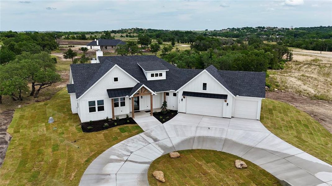 Front exterior of a new home in , Weatherford, TX, highlighting curb appeal (Image 25).