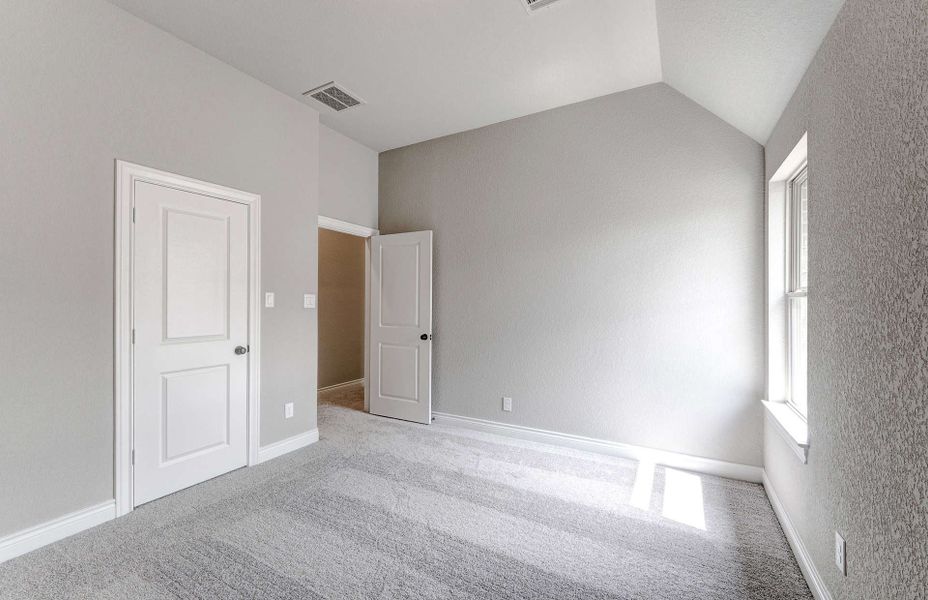 Representative unfurnished interior of a home built from the 3799 by Ravenna Homes in Artavia 70′, Conroe (Image 53).