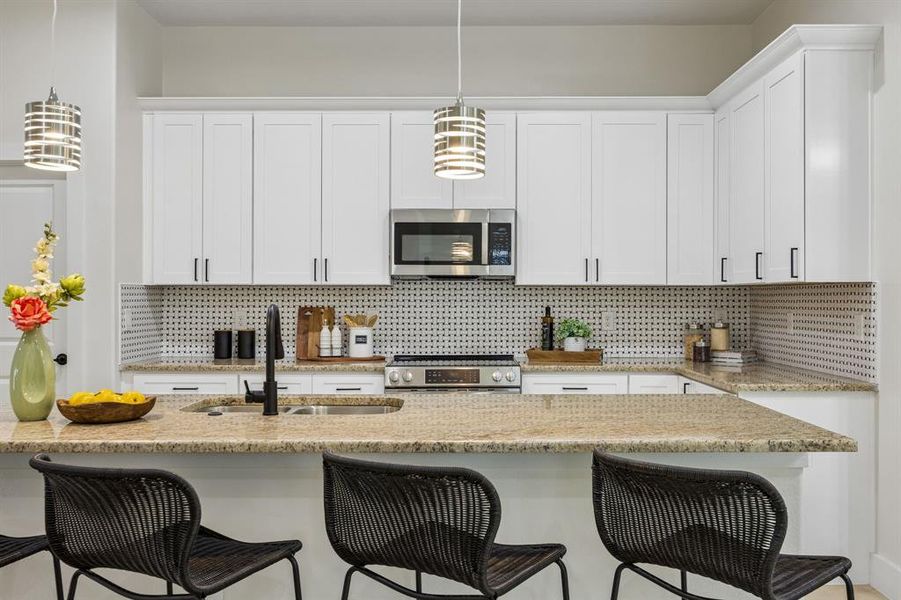 Open-concept kitchen featuring a large island perfect for a quick breakfast.