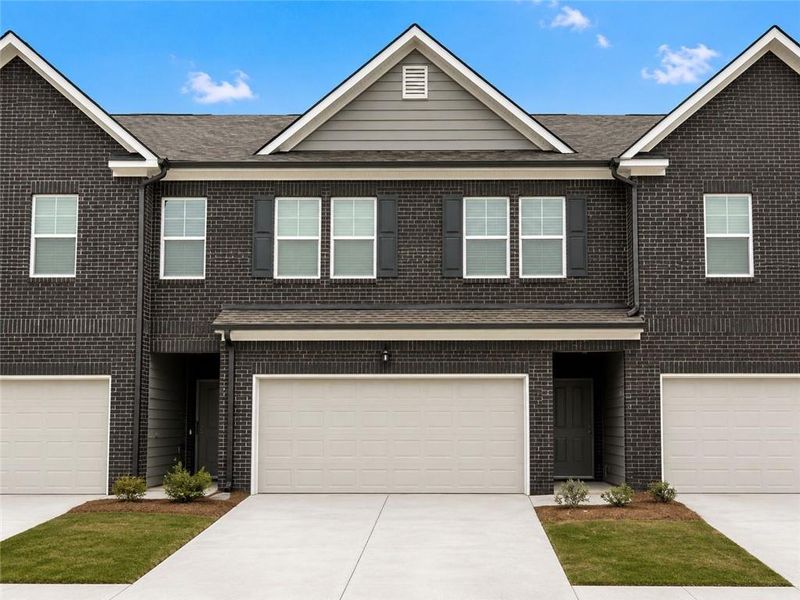 Front exterior of a new home in Reeves Park, Stockbridge, GA, highlighting curb appeal (Image 1). Front exterior of a new home in Reeves Park, Stockbridge, GA, highlighting curb appeal (Image 1).