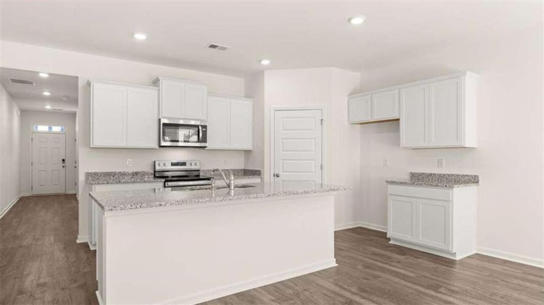 Furnished interior view inside a new home in Oakchase at Hampton, Hampton (Image 5).