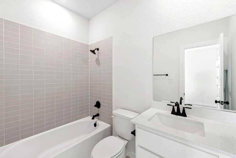 Furnished interior view inside a new home in University Heights, Round Rock (Image 13).