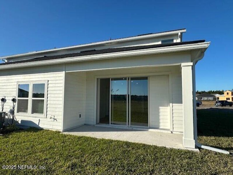 Exterior details and patio area of a home in Brook Forest - Villas, St. Augustine (Image 17).