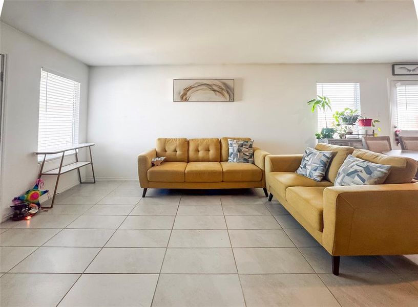 Living area featuring light tile patterned flooring
