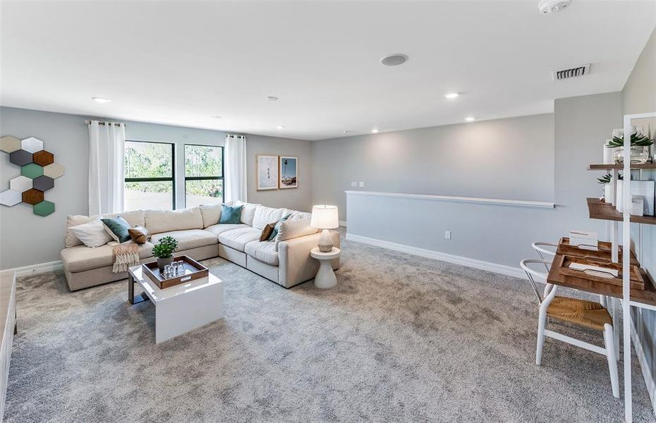 Furnished interior view inside a new home in The Strand at Cedar Grove, North Port (Image 14). Furnished interior view inside a new home in The Strand at Cedar Grove, North Port (Image 14).