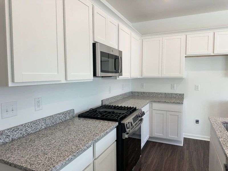 Kitchen - Chic white finishes and smooth surfaces shine. Kitchen - Chic white finishes and smooth surfaces shine.