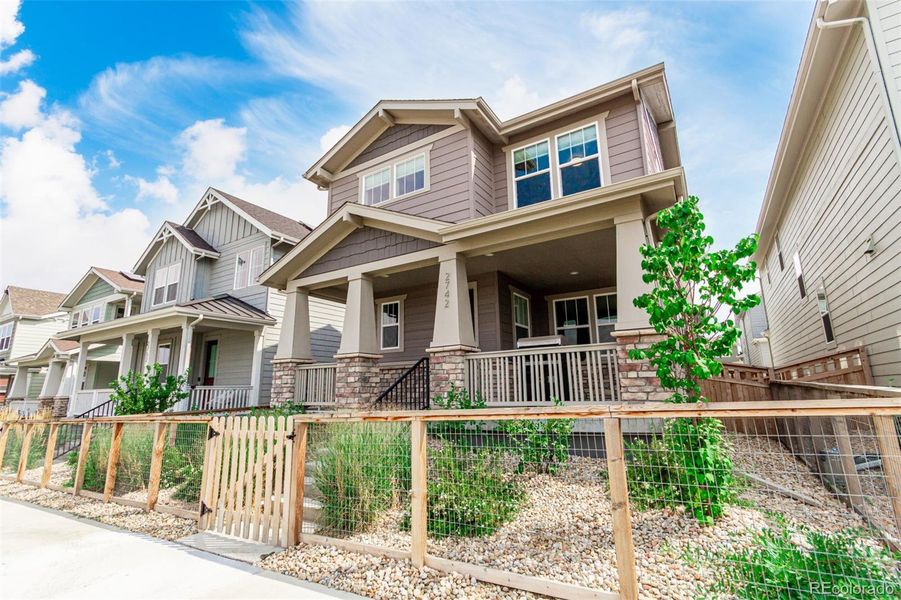 Front exterior of a new home in Arras Park, Thornton, CO, highlighting curb appeal (Image 21).