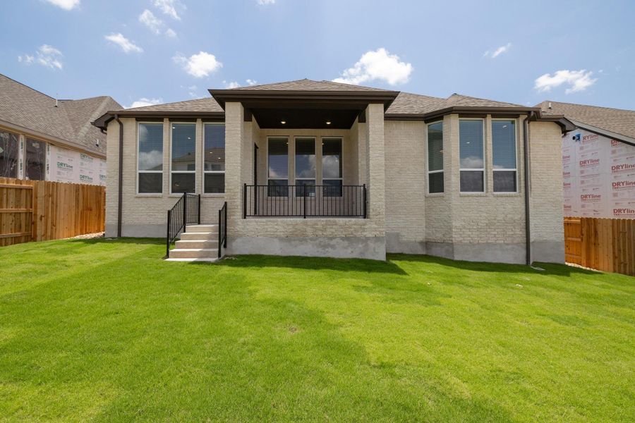 Front exterior of a new home in Palmera Ridge: 60ft. lots, Leander, TX, highlighting curb appeal (Image 14). Front exterior of a new home in Palmera Ridge: 60ft. lots, Leander, TX, highlighting curb appeal (Image 14).