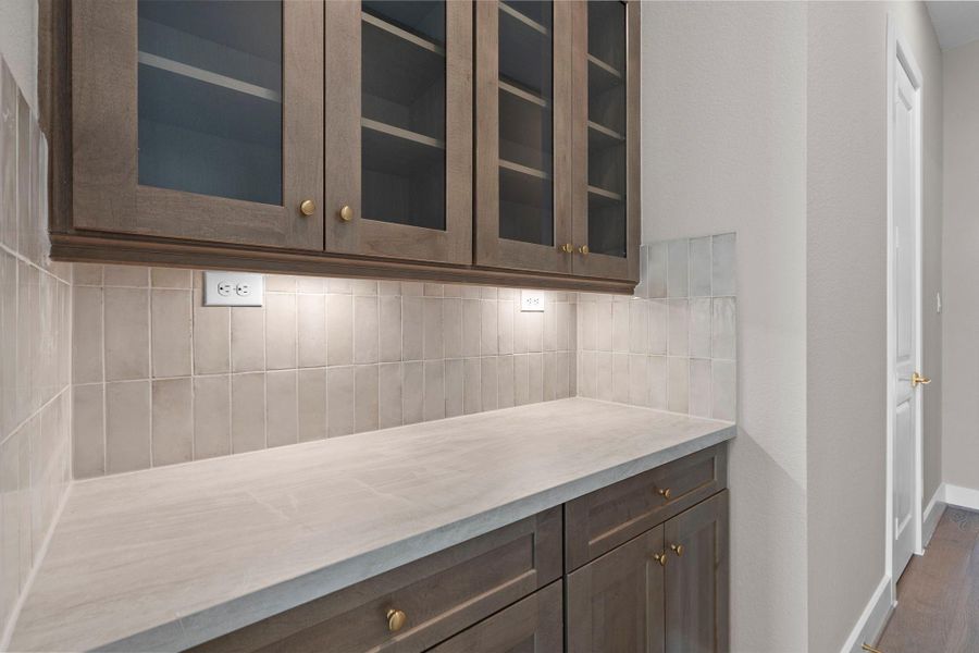 Beautiful butler's pantry between the kitchen and dining room Beautiful butler's pantry between the kitchen and dining room