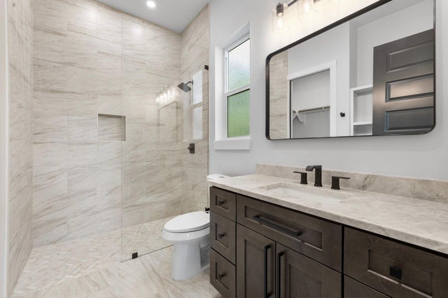 The lower-level ensuite bathroom. The lower-level ensuite bathroom.