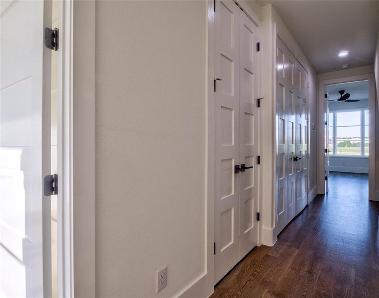 Hall with dark wood-type flooring