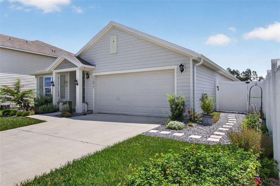 Front exterior of a new home in Briarwood, Alachua, FL, highlighting curb appeal (Image 20).