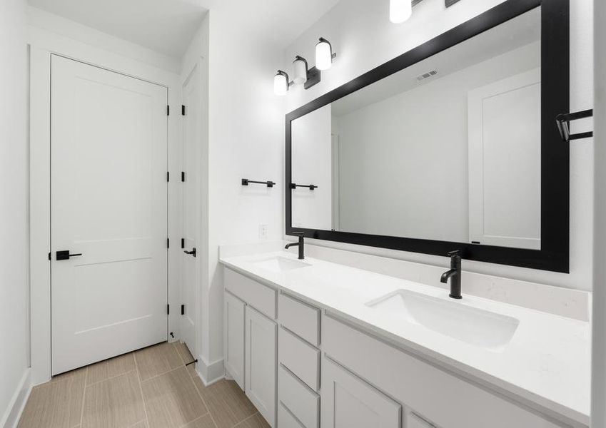 The secondary bathroom has a large vanity with plenty of cabinet space.