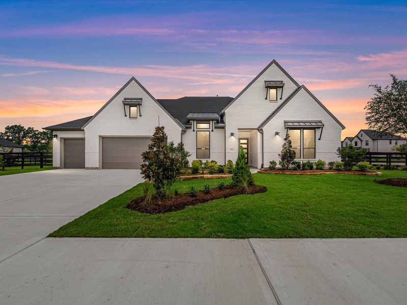 Front exterior of a new home in The Estates at James Lane, Fulshear, TX, highlighting curb appeal (Image 19).