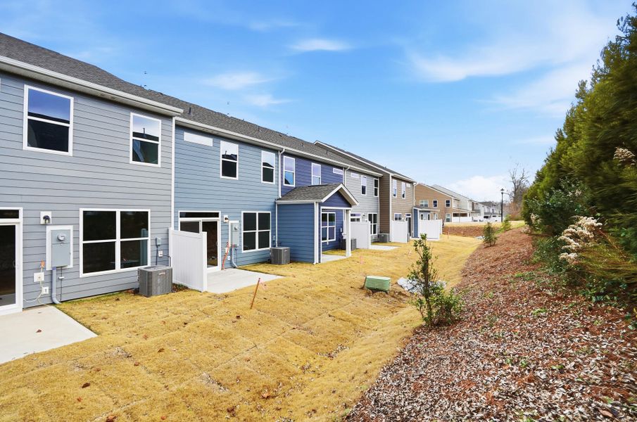 Exterior details and patio area of a home in Harrisburg Village Townhomes, Harrisburg (Image 26).